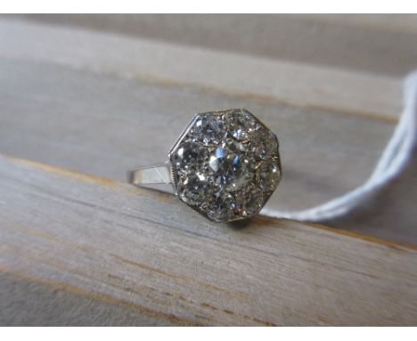 Art Deco style octagonal diamond set ring with a central stone surrounded by eight further smaller stones, approximately 1.1c