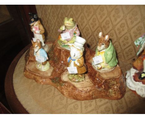 Group of five Beswick Beatrix Potter figures, complete with stand (at fault)Samuel Whiskers has broken feet and chipped ears,