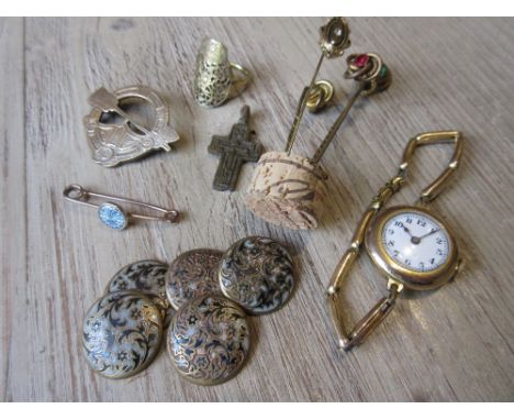 Small bag containing a ladies gold plated wristwatch, various tie pins, buttons etc 