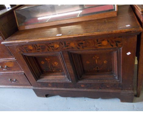 18th / 19th Century Flemish oak and marquetry inlaid coffer, the hinged lid above a two panel front on bracket feetThe lid ap