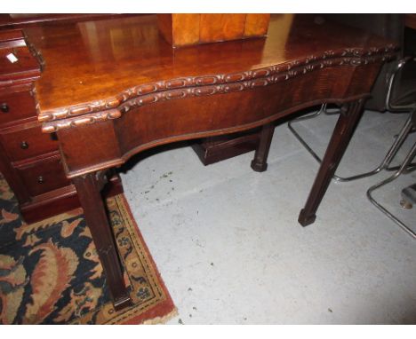 Georgian style mahogany serpentine fronted fold-over card table with baize lined interior, on square chamfered reeded front s