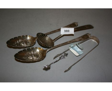 George III silver ladle with shell form bowl, pair of George III silver berry spoons, pair of silver sugar tongs and a Contin