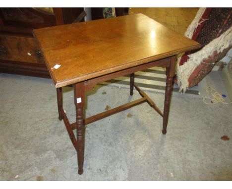 Two rectangular walnut Arts and Crafts occasional tables with ring turned supports and stretchers 