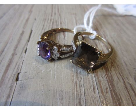 9ct Gold amethyst and diamond dress ring, together with a 9ct gold smoky quartz and diamond set dress ring 