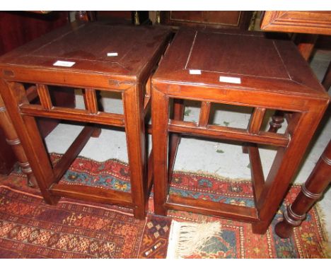 Pair of Chinese low rectangular lamp tables on square supports with peripheral stretchers, 18ins high x 15ins x 12.5ins each 