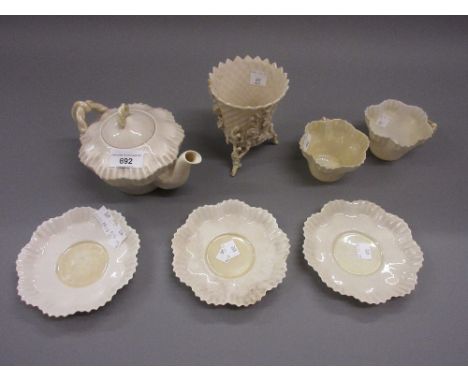 Belleek plain white glazed teapot (black mark) together with four matching cups and saucers, Belleek vase (at fault) and a Be