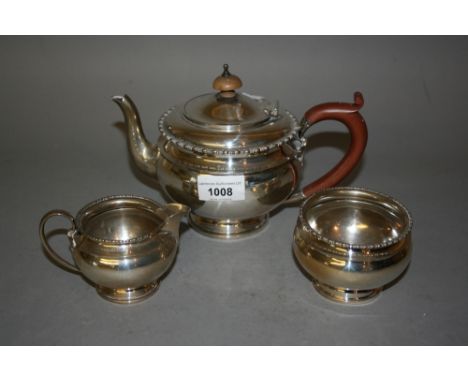 20th Century Mappin and Webb silver three piece tea service of circular squat design 