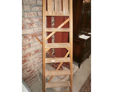pair of wooden step ladders