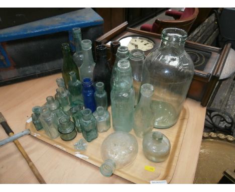 tray of vintage glass bottles