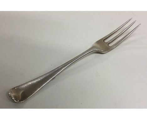 A early Georgian silver Hanoverian pattern three prong dessert fork. Approx. 41 grams. Est. £40 - £60.