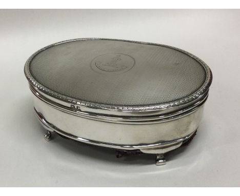 An engine turned silver hinged top jewellery box. Birmingham. Approx. 260 grams. Est. £70 - £80.