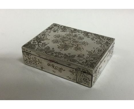 A good quality silver compact profusely decorated with scrolls and flowers. Approx. 157 grams. Est. £100 - £150.