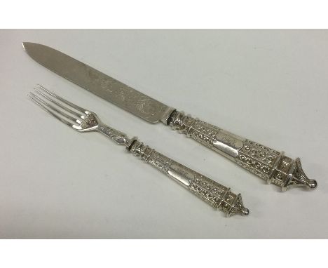 A heavy Victorian silver serving knife and fork with tapering handles. Sheffield 1871. By Martin Hall. Approx. 182 grams. Est