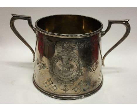 A large tapering Victorian silver sugar basin attractively decorated with flowers and leaves. Sheffield. By C&amp;H. Approx. 