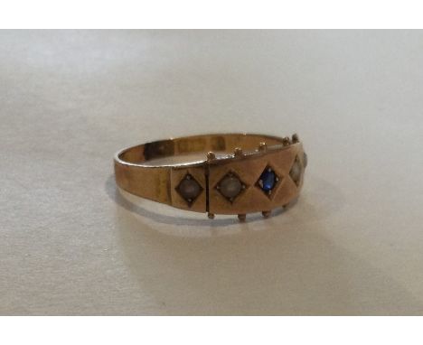 A 15 carat gold sapphire and pearl ring. Approx. 2 grams. Est. £30 - £50.