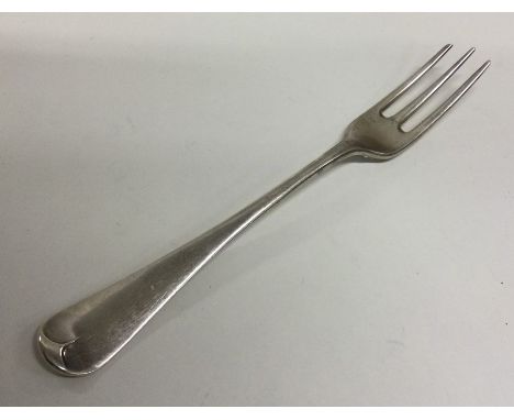 A heavy Georgian three prong fork. London. By WI. Approx. 26 grams. Est. £35 - £45.