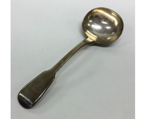 A fiddle pattern silver sauce ladle. London. By EB. Approx. 84 grams. Est. £20 - £30.