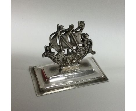 A cast silver menu holder in the form of a Galleon. London. by Mappin &amp; Webb. Approx. 29 grams. Est. £35 - £45.