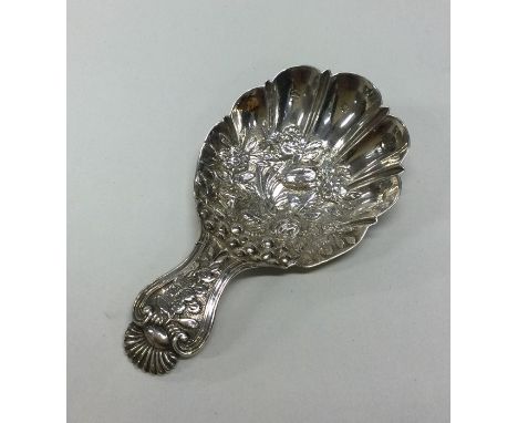 A heavy chased silver caddy spoon. Birmingham. By Joseph Wilmore. Approx. 11 grams. Est. £70 - £80.