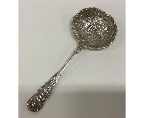 A decorative Continental silver ladle cast with figures. Approx. 38 grams. Est. £40 - £60.