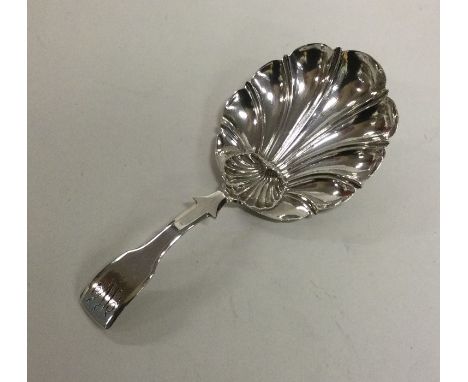 An unusual silver caddy spoon with shell bowl. London 1818. By William Weston. Approx. 10 grams. Est. £50 - £80.