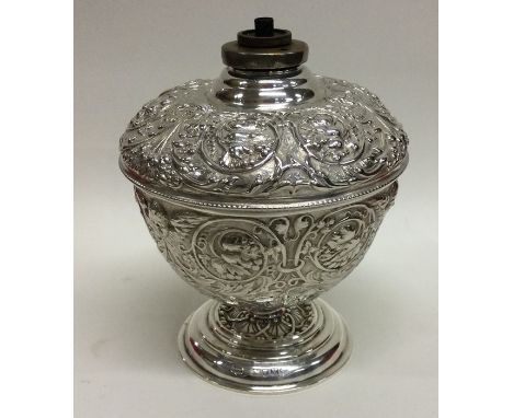 A rare Victorian silver embossed oil lamp attractively chased with flowers and leaves. London 1887. By Mappin &amp; Webb. App