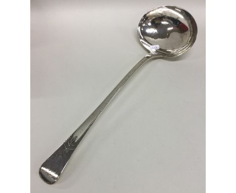 A heavy 18th Century bright cut silver soup ladle. London 1799. By Samuel Hennell. Approx. 134 grams. Est. £100 - £200.