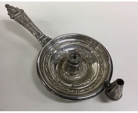 An Edwardian silver Aladdin's' lamp decorated with figures and foliage. London. By Cd. Approx. 172 grams. Est. £100 - £150.