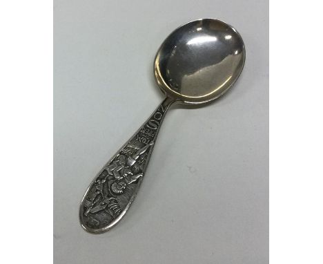 An unusual silver caddy spoon decorated with a nursery rhyme. Approx. 20 grams. Est. £20 - £30.