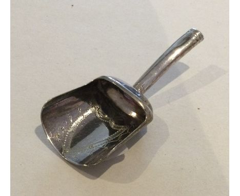 A Georgian silver caddy scoop with bright cut decoration. Birmingham. By JT. Approx. 5 grams. Est. £30 - £50.