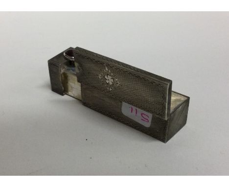 A Continental silver lipstick holder with engine turned decoration. Approx. 25 grams. Est. £20 - £30.
