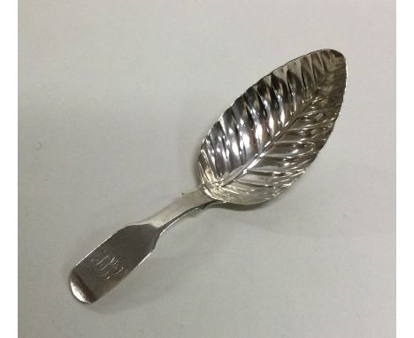 A Georgian silver half fluted caddy spoon with leaf bowl. London. By George Hunt. Approx. 8 grams. Est. £35 - £45.