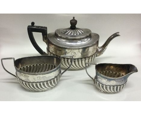 A good Victorian silver half fluted tea service. Sheffield. By H&amp;H. Approx. 440 grams. Est. £200 - £300.