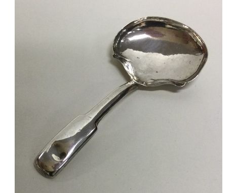 A George III fiddle pattern silver caddy spoon. Birmingham 1813. Approx. 8 grams. Est. £15 - £20.