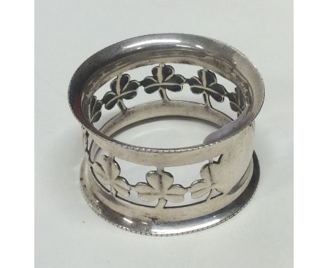 A good quality silver napkin ring decorated with clovers. Chester. By J&amp;S. Approx. 18 grams. Est. £15 - £20.