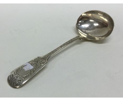 A Victorian silver fiddle pattern cream ladle. Birmingham. By JU. Approx. 25 grams. Est. £20 - £30.