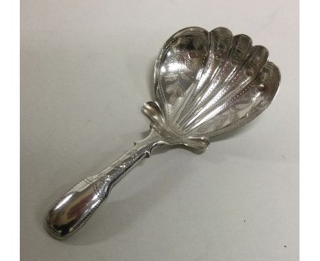 A heavy silver engraved caddy spoon with fluted bowl. Birmingham. By JB. Approx. 8 grams. Est. £50 - £80.