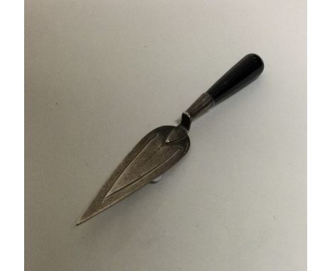 A small silver bookmark in the form of a trowel. Approx. 6 grams. Est. £20 - £30.