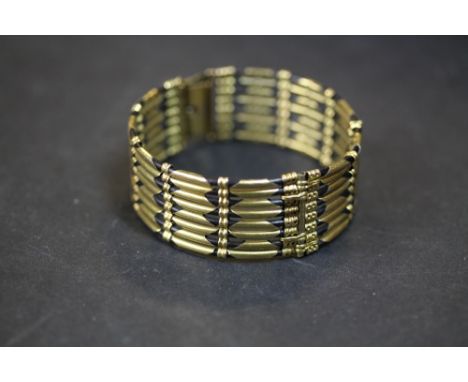 Gilt metal 4 bar gate bracelet/bangle