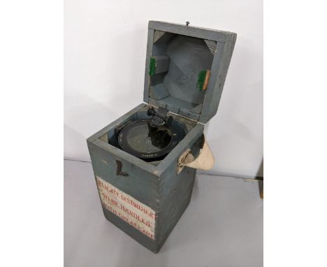 A military issue ships compass, type OGA, in a grey painted boxLocation: 