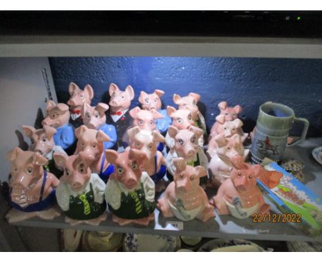 A collection of Wade Natwest money bank pigs to include two bank managers, an Irish Wad musical hunting mug, boxed set of KP 