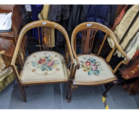 Two Edwardian inlaid mahogany curved back chairs, with tapestry seatsLocation: 