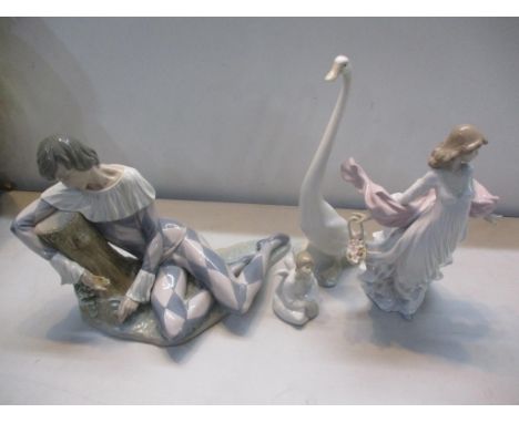 A collection of Lladro and Nao to include Lladro Harlequin Reclining, Lladro figurine Spring Splendour girl with flowers and 