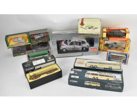 A group of boxed model cars to include a large 1:18 scale European collectables American Airlines London Taxi, Corgi 471 bus 