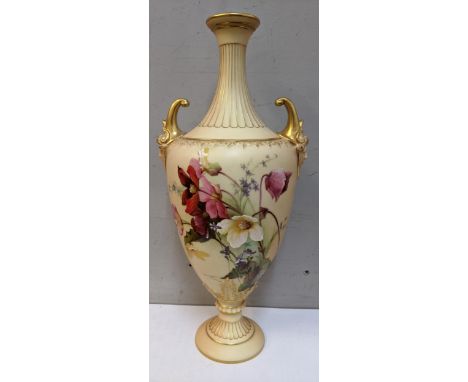 A Royal Worcester blush ivory hand painted porcelain vase with gilt scroll handles and decorated with flowers, numbered 1911 