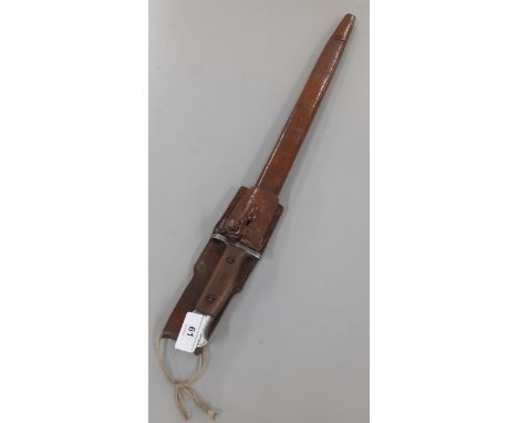 An early 20th century bayonet in a leather scabbard with Mark Wilkinson 1907 to the blade 