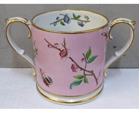 A 19th century Worcester twin-handled loving cup on a pink ground decorated with butterflies and flowers, marked Grainger & C