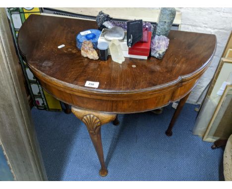 An early 20th century walnut Queen Anne style fold over card table, 74cmh x 81cm wLocation: 