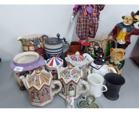 Mixed ceramic household ornaments to include Sadler teapots, Beswick jugs, a black Wedgwood basalt vase, two clowns and a Fal