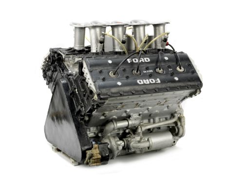 A Ford Cosworth DFV fibreglass display motor,painted black, silver and red, fitted with dummy ancillaries including water pum